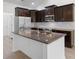 Spacious kitchen featuring a center island with granite countertops, and stainless steel appliances at 124 Shady Arbor Loop, Longs, SC 29568