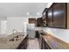 Well-equipped kitchen featuring stainless steel appliances, granite countertops, and dark cabinetry at 124 Shady Arbor Loop, Longs, SC 29568
