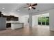 Open kitchen featuring granite countertops, stainless appliances, and an adjacent dining area with backyard views at 124 Shady Arbor Loop, Longs, SC 29568