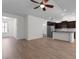 Spacious kitchen and living area with stainless steel appliances, granite countertops, and ample natural light at 124 Shady Arbor Loop, Longs, SC 29568