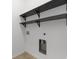 Laundry room with black shelving and washer-dryer hookups ready for appliance installation at 124 Shady Arbor Loop, Longs, SC 29568