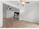 Bright living room opens to the kitchen with ceiling fan and views into the kitchen at 124 Shady Arbor Loop, Longs, SC 29568