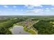 Stunning aerial view of a community nestled alongside a lake and surrounded by lush, mature trees at 1304 Marley St., Conway, SC 29527