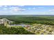 Aerial view showcases the property, nestled near a lake and surrounded by lush greenery and mature trees at 1304 Marley St., Conway, SC 29527