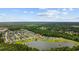 An aerial view of a charming neighborhood, surrounded by lush forests and a picturesque lake at 1304 Marley St., Conway, SC 29527