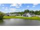 Aerial view of homes surrounding a lake, featuring lush greenery and well-manicured lawns at 1304 Marley St., Conway, SC 29527