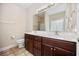 Bathroom featuring double sinks, a vanity with wood cabinets, and a large mirror at 1304 Marley St., Conway, SC 29527