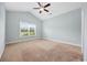 Bright bedroom featuring a neutral color palette, large windows, and a ceiling fan at 1304 Marley St., Conway, SC 29527