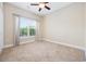 Bright bedroom with neutral carpet, a ceiling fan, and a window at 1304 Marley St., Conway, SC 29527