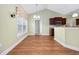 Bright dining area features wood floors, vaulted ceiling, and large windows at 1304 Marley St., Conway, SC 29527