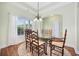 Dining room boasts a glass table, decorative rug and large window at 1304 Marley St., Conway, SC 29527