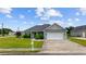 Charming one-story home features a manicured lawn and attached two-car garage at 1304 Marley St., Conway, SC 29527