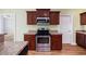 Kitchen featuring stainless steel appliances, wood cabinetry, and granite countertops at 1304 Marley St., Conway, SC 29527