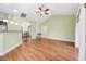 Bright living room featuring vaulted ceilings, a fan, and a view into the kitchen and dining area at 1304 Marley St., Conway, SC 29527