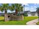 Charming community entrance with brick signage and palm trees, nestled in a beautifully landscaped setting at 1304 Marley St., Conway, SC 29527
