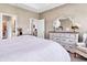 Bright bedroom showcasing a large bed, plush carpeting, and elegant decor at 136 Crabapple Dr., Longs, SC 29568