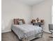 Comfortable bedroom with a wood frame bed, neutral decor, and a desk area at 136 Crabapple Dr., Longs, SC 29568