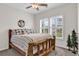 Cozy bedroom with a rustic wooden bed frame, plantation shutters, and neutral decor at 136 Crabapple Dr., Longs, SC 29568