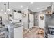 Open kitchen with white cabinetry, stainless steel appliances and granite countertops at 136 Crabapple Dr., Longs, SC 29568