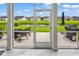 A screened-in porch looks out to a backyard with a pond view at 136 Crabapple Dr., Longs, SC 29568