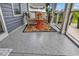 Comfortable screened porch with stylish furniture and a view of the outdoors at 136 Crabapple Dr., Longs, SC 29568