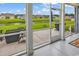 Relaxing screened porch overlooking a scenic pond and well-maintained lawn at 136 Crabapple Dr., Longs, SC 29568