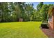 Large, well-maintained backyard with lush green grass and storage shed at 1478 Bluegil Dr., Longs, SC 29568