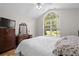 Well-lit bedroom featuring hardwood floors, vaulted ceiling and traditional furnishings at 1478 Bluegil Dr., Longs, SC 29568