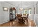 Dining area with hardwood floors, natural lighting, and decorative chandelier at 1478 Bluegil Dr., Longs, SC 29568