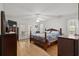 Spacious main bedroom with hardwood floors, ceiling fan, and access to exterior porch at 1478 Bluegil Dr., Longs, SC 29568