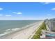 An expansive view of the beach showing the shoreline and building location at 1605 S Ocean Blvd. # 1403, Myrtle Beach, SC 29577