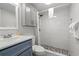 Updated bathroom featuring shower with pebble floor and modern vanity at 1605 S Ocean Blvd. # 1403, Myrtle Beach, SC 29577