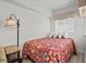 Charming bedroom with comfortable bed, side table and lamps at 1605 S Ocean Blvd. # 1403, Myrtle Beach, SC 29577