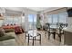 Cozy living room with ocean view, dining area, and sleeper sofa at 1605 S Ocean Blvd. # 1403, Myrtle Beach, SC 29577