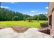 Large backyard featuring a spacious lawn and steps leading to the porch at 1752 Patriot Ct., Mullins, SC 29574