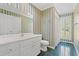 Bathroom featuring wallpaper, white vanity, and a shower with a window at 1752 Patriot Ct., Mullins, SC 29574