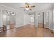 Spacious bedroom with mirrored closets and ceiling fan at 1752 Patriot Ct., Mullins, SC 29574