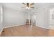 Bedroom with wood-look flooring, mirrored closet doors, and ceiling fan at 1752 Patriot Ct., Mullins, SC 29574