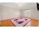 Bright bedroom with hardwood floors, a large rug, and a decorative chandelier at 1752 Patriot Ct., Mullins, SC 29574