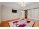 Bedroom features hardwood floors, a large rug, and a barn door at 1752 Patriot Ct., Mullins, SC 29574