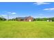 Spacious lot with well-maintained grass surrounding the brick home at 1752 Patriot Ct., Mullins, SC 29574