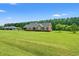 Brick home on a large lot with mature trees in background at 1752 Patriot Ct., Mullins, SC 29574