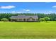 Well-manicured lawn complements this brick home with mature trees at 1752 Patriot Ct., Mullins, SC 29574