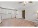 Eat in kitchen featuring white cabinetry, laminate flooring and convenient laundry area at 1752 Patriot Ct., Mullins, SC 29574