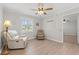 Living room with neutral walls, wood-look floors, and two comfortable armchairs at 1752 Patriot Ct., Mullins, SC 29574