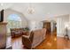 Spacious living area featuring hardwood floors, large windows, and open layout at 1752 Patriot Ct., Mullins, SC 29574