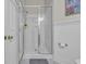 Bathroom featuring a glass-enclosed shower with modern fixtures and tiled walls, creating a clean and functional space at 179 Cottage Ct., Pawleys Island, SC 29585