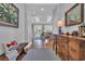 Bright foyer with hardwood floors, decorative pillows, and views of the living area through open doorways and skylights at 179 Cottage Ct., Pawleys Island, SC 29585