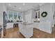 Well-equipped kitchen with custom cabinetry, granite countertops, and center island workstation at 179 Cottage Ct., Pawleys Island, SC 29585