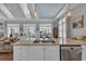Open-concept kitchen with granite counters, stainless appliances, and views to living spaces at 179 Cottage Ct., Pawleys Island, SC 29585